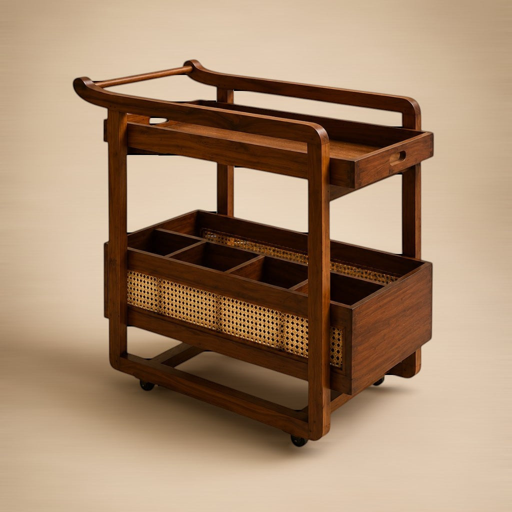 My Store two-tier teak bar cart with curved handles, cane-woven bottle compartments, and castor wheels.